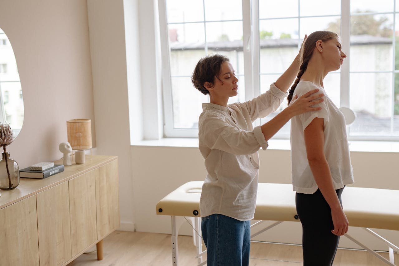 Physical Therapist Giving a Massage to a Woman 